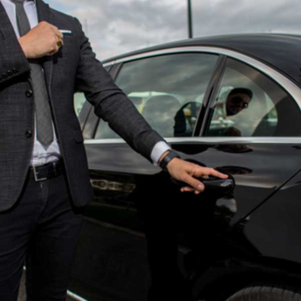 guy opening door of car